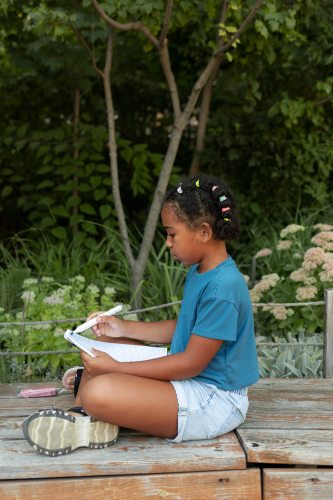 child writing at the zoo child writing at the zoo
